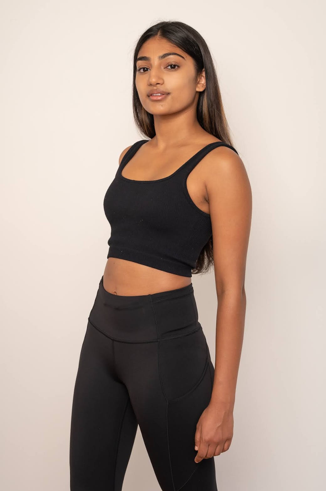 Mahika Valluri, three-quarter studio portrait in black athletic wear